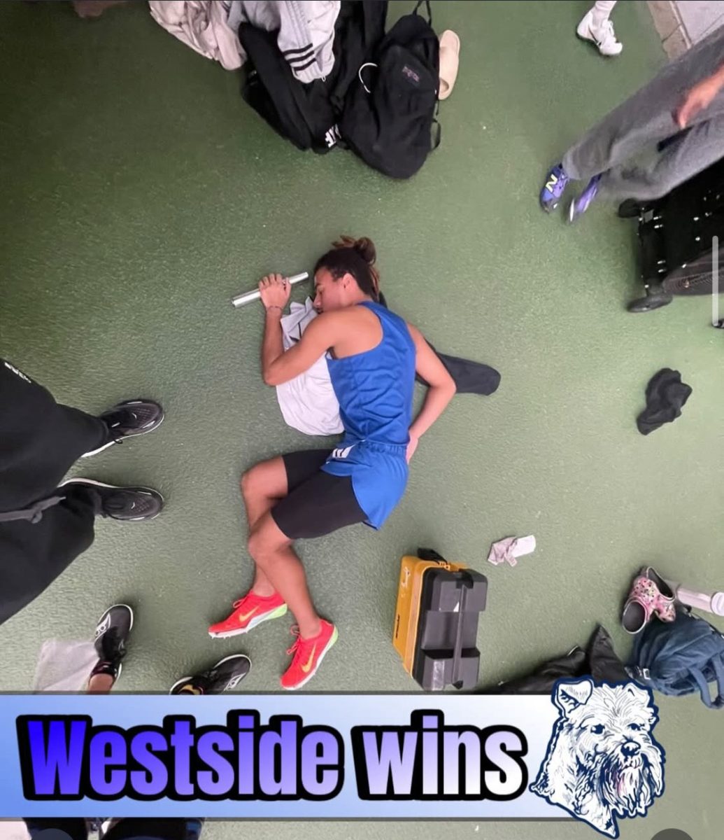 Jaisyn Fasser in locker room after the Track & Field team's win against Ludlow.